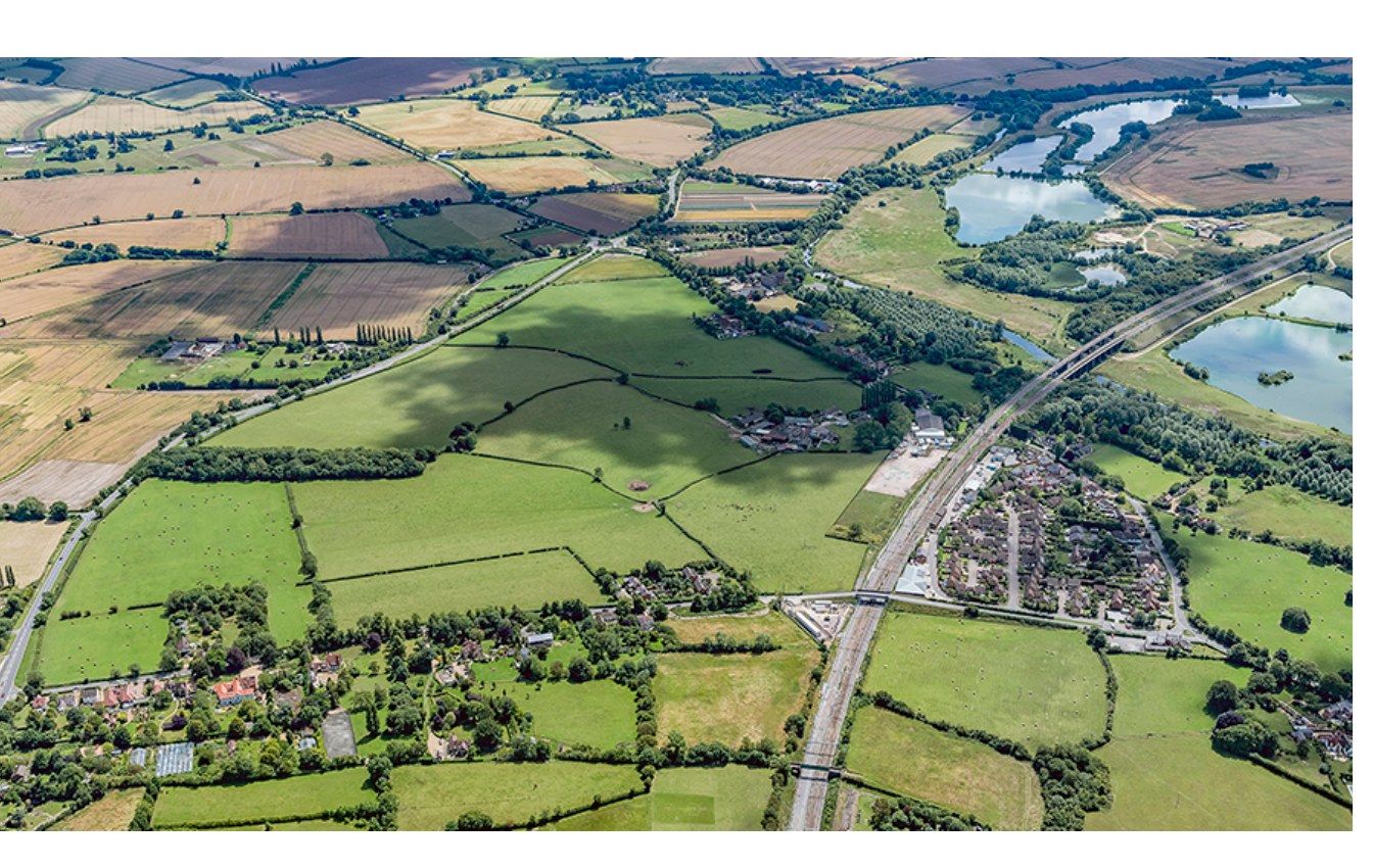 English countryside and motorway infrastructure, aerial view